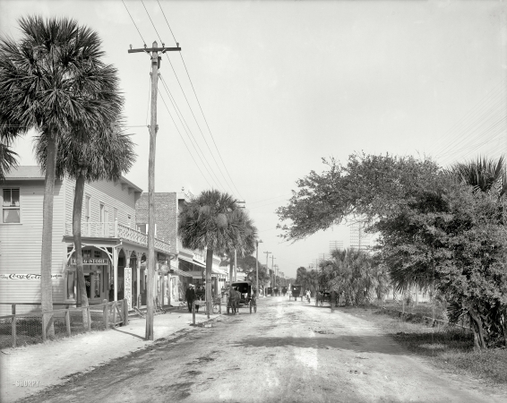 Photo showing: Beach Street -- Florida circa 1904. Beach Street, Daytona. Note the early Coca-Cola sign on Burdine's Pharmacy.