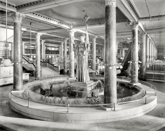 Photo showing: Temple of Shopping -- Siegel Cooper & Co., the fountain. Republic statue in the New York department store, circa 1910.
