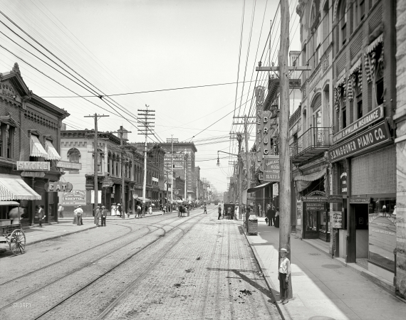 Photo showing: Mexican Mustang -- Knoxville, Tennessee, circa 1905. Gay Street looking north from Clinch Avenue.
Featuring the Mayor of Gay Street, and sponsored by Mexican Mustang Liniment.