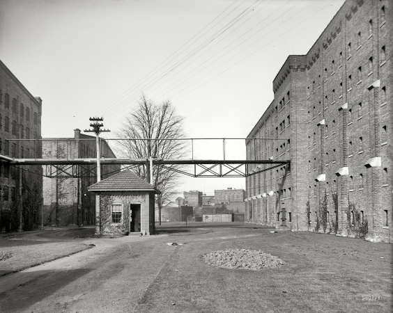 Photo showing: Whiskeytown -- Walkerville, Ontario, circa 1900. Avenue of rack warehouses, Hiram Walker & Sons.