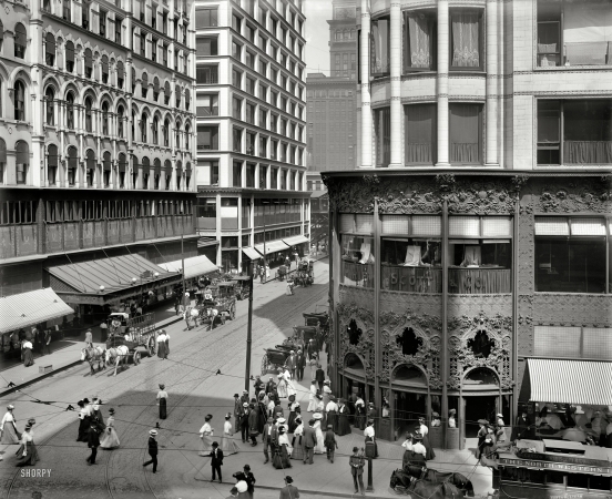 Photo showing: Madison and State -- Chicago circa 1907. Merchants include Carson Pirie Scott and Mandel Bros.; also: Montgomery Ward delivery wagons.