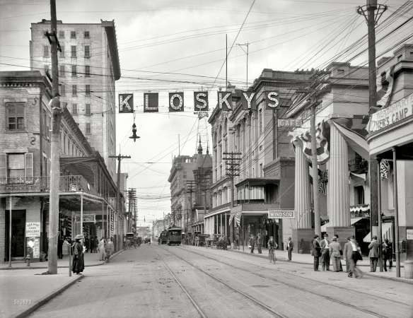Photo showing: This Way to Kloskys -- Mobile, Alabama, circa 1910. Royal Street looking north.