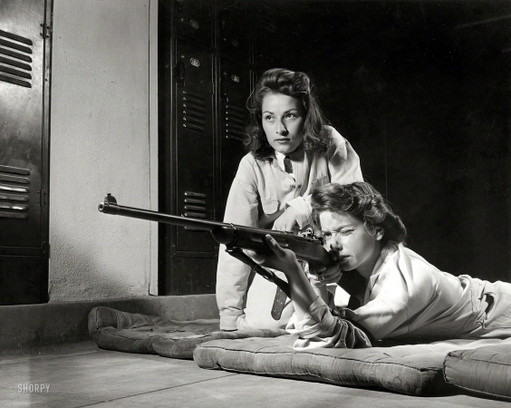 Photo showing: Victory Corps -- August 1942. Training in marksmanship helps girls at Roosevelt High School in Los Angeles
develop into responsible women. Part of Victory Corps activities.