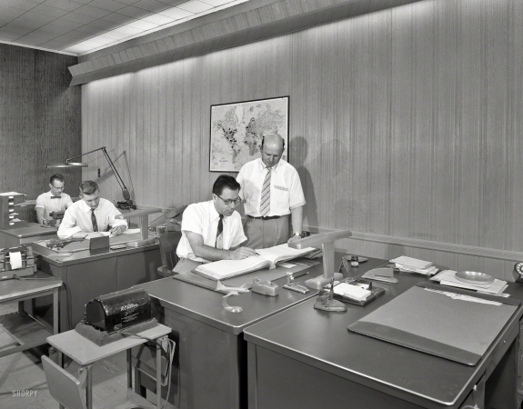 Photo showing: Desk Set. -- June 26, 1956. Ledkote Inc., Vernon Boulevard, Astoria, Long Island. Office accounting department.