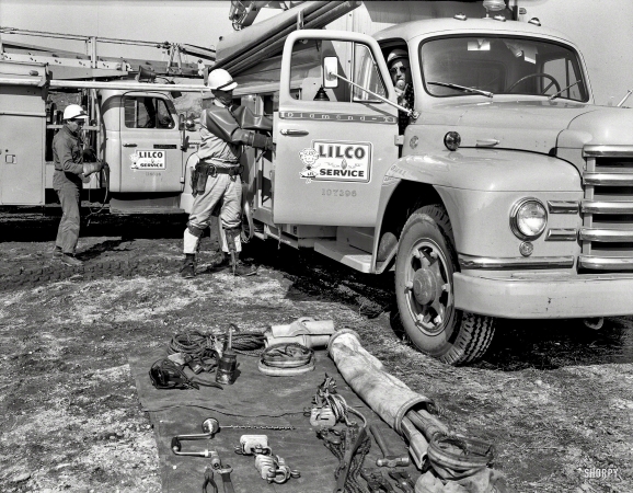 Photo showing: Diamonds for Lil -- March 3, 1959. Long Island Lighting Co. service trucks and men. 