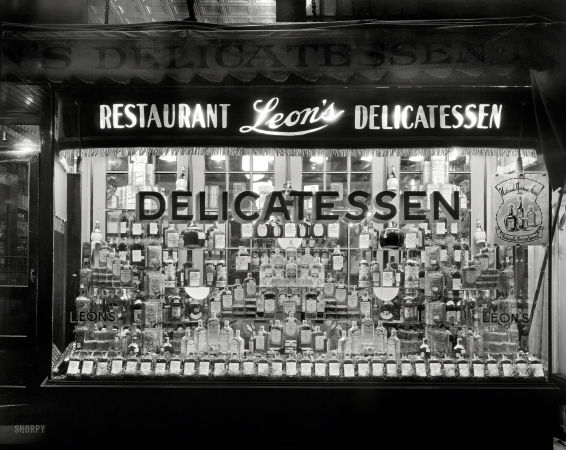 Photo showing: Toast of the Town -- Washington, D.C., circa 1934. Leon's Delicatessen, 1131 14th Street NW. Window display of whiskey.