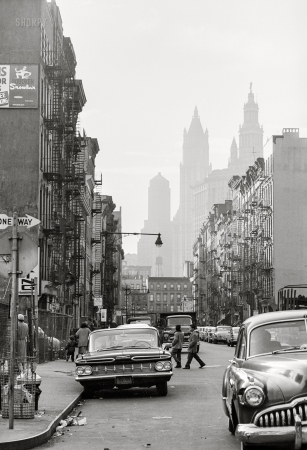 Photo showing: East Side Story -- -- November 4, 1959. People and cars, Essex Street and Henry Street, Lower East Side, New York City.