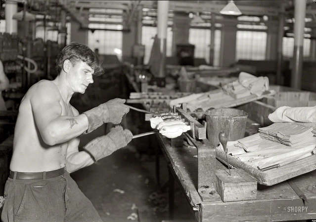 Photo showing: Hot Bodies -- 1936. Mt. Holyoke, Mass. -- Paragon Rubber Co. and American Character Doll. Stripping rubber bodies off core-bars (French).