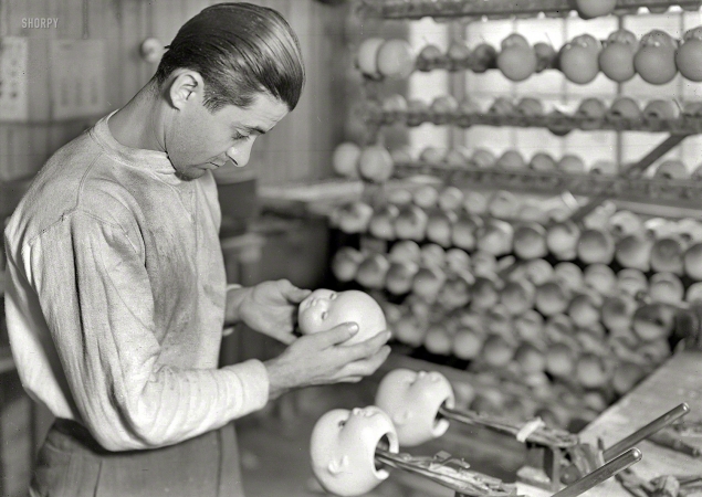 Photo showing: Doll Eye Inserter -- 1936. Mt. Holyoke, Mass. Paragon Rubber Co. and American Character Doll. Setting eyes in sleeping dolls.