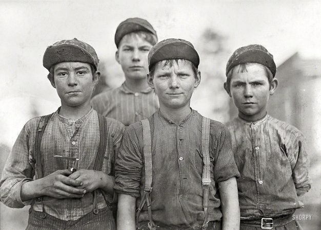 Photo showing: Some Doffer Boys -- January 1909. Macon, Georgia. Some doffer boys.