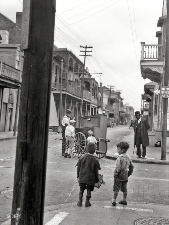 Photo showing: Bourbon Boys -- Bourbon Street and Ursulines Avenue circa 1924. New Orleans organ grinder.