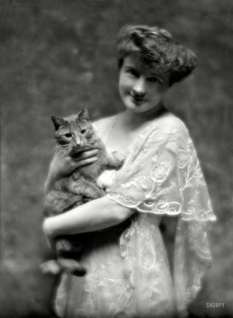 Photo showing: Cat-Woman -- May 12, 1914. King, G., Miss, with Buzzer the cat. 135 E. 66th Street, New York City.