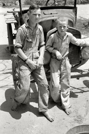 Photo showing: Washed Up -- June 1939. Muskogee County, Okla. Sons of agricultural day laborer after washing up for dinner.