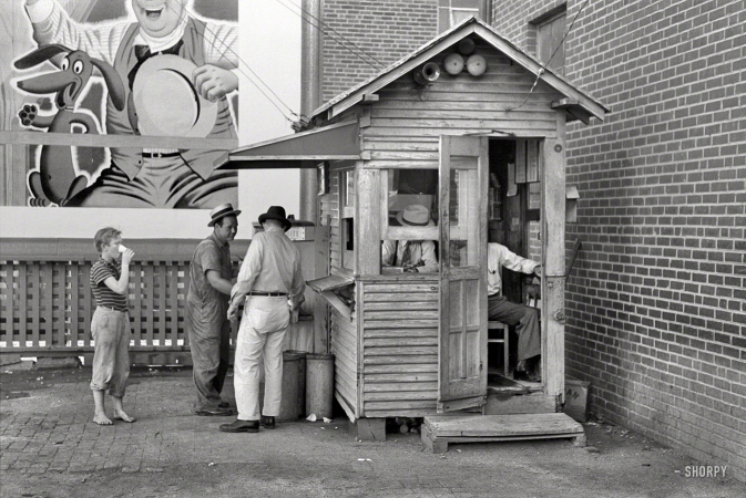Photo showing: The Car Shack -- July 1939. Activity around station master's shack. Streetcar terminal, Oklahoma City.