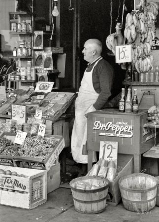 Photo showing: Drink Dr. Pepper -- November 1939. Waco, Texas. Proprietor of small store in market square.
