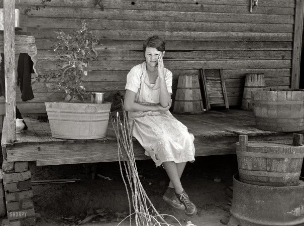 Photo showing: In the Sticks -- Sept. 1935. Daughter of farmer who will be resettled. Wolf Creek Farms, Georgia.