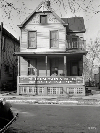 Photo showing: Home Office -- December 1935. House in Cincinnati showing its conversion into businesses and blight.