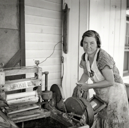 Photo showing: The Washday Miracle -- May 1936. Wife of farmstead farmer. Kearny, Nebraska.