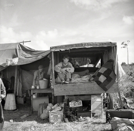 Photo showing: American Pickers -- January 1937. Migrant agricultural workers. Family from
New Mexico, camped near the packinghouse at Deerfield, Florida.