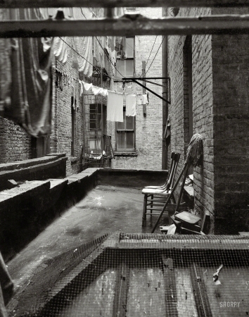 Photo showing: Tenement View -- June 1936. Out of rear window tenement dwelling of Mr. and Mrs. Jacob Solomon, 133 Avenue D, New York City.