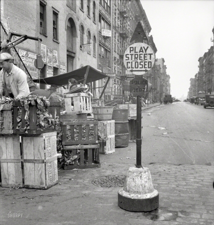 Photo showing: Play Street -- June 1936. Background photo for Hightstown project. Play street for children. Sixth Street and Avenue C, New York City.