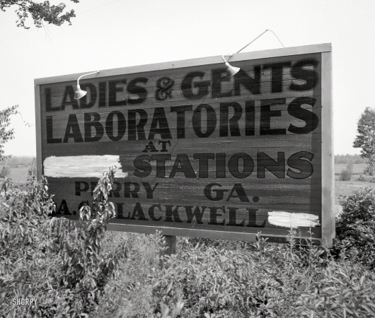 Photo showing: Experimental Exit -- July 1936. Gas station road sign near Perry, Georgia.