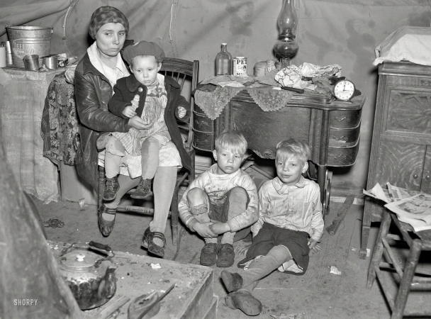 Photo showing: Flood Refugees -- April 1937. Part of flood refugee family in a tent at Tent City near Shawneetown, Illinois.