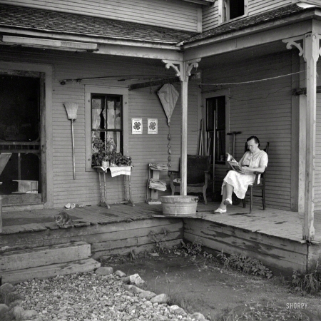 Photo showing: Time for TIME -- July 1940. Reading on the front porch. Lincoln, Vermont.