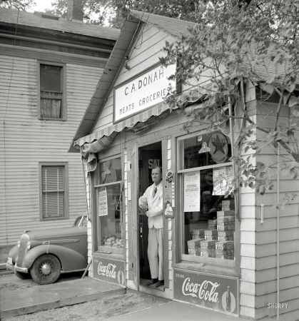 Photo showing: Small Business -- July 1940. General store in Lincoln, Vermont. C.A. Donah Meats & Groceries. 