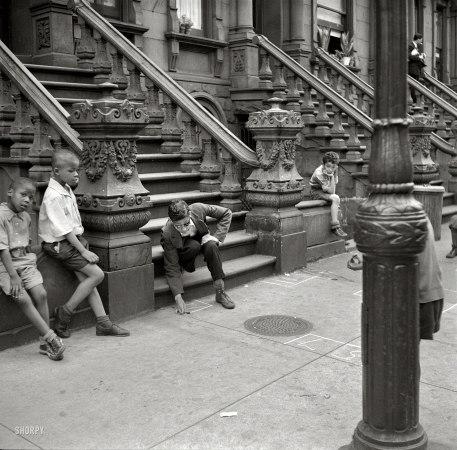 Photo showing: Summer Games -- Summer 1938. New York street scene -- boys playing.