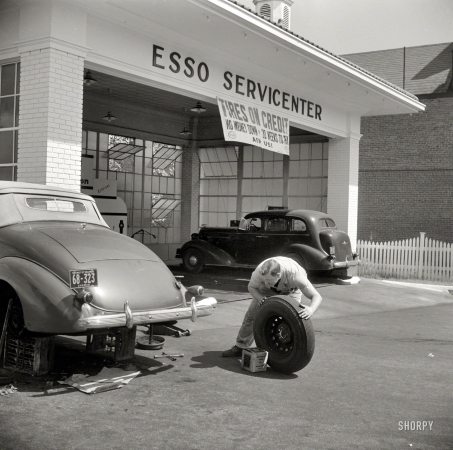 Photo showing: Tires on Credit -- September 1940. Washington, D.C. Service station on Connecticut Avenue.
