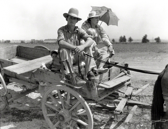 Photo showing: Parched Okies -- August 1939. Drought-stricken farmer and family near Muskogee, Oklahoma. Agricultural day laborer.