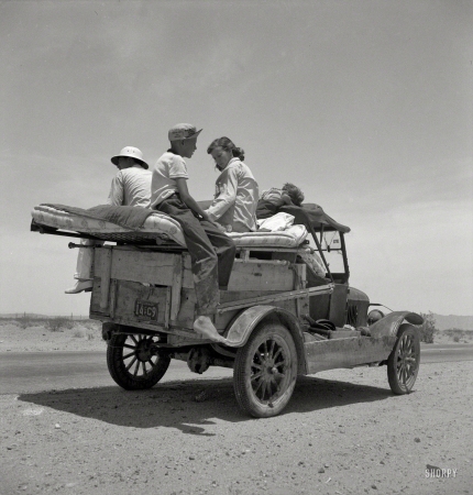 Photo showing: Family Trip -- May 1937. Migratory family traveling across the desert in search of work
in the cotton at Roswell, New Mexico. U.S. Route 70, Arizona.