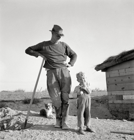 Photo showing: Daddys Little Farmer -- October 1939. Mr. Dougherty and one of the children. Warm Springs district, Malheur County, Oregon.