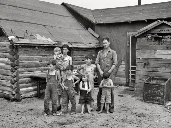 Photo showing: Pitchfork Manor -- June 1937. Art Simplot and family in front of their house near Black River Falls, Wisconsin.