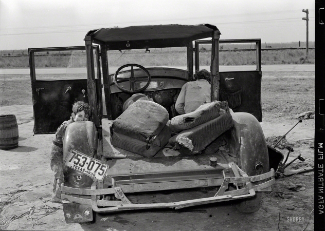 Photo showing: Family Car -- February 1939. White migrant and wife repairing clutch in their car near Harlingen, Texas.