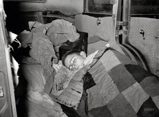 Photo showing: Do Not Disturb -- February 1939. White migrant boy asleep in car. He came with his father from Houston to Edinburg, Texas.