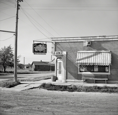 Photo showing: Liquid Assets -- August 1937. Former bank, now a saloon. Mizpah, Minnesota.