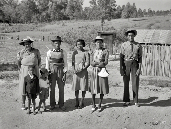 Photo showing: Back From the Grave -- June 1941. Greene County, Georgia. Family who has just come back from a funeral.