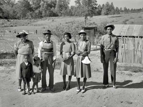Photo showing: Back From the Grave -- June 1941. Greene County, Georgia. Family who has just come back from a funeral.