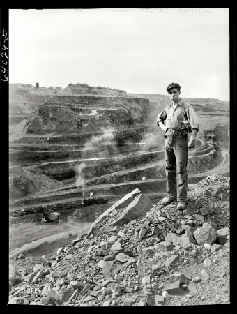 Photo showing: Iron Man -- August 1941. Hull-Rust-Mahoning pit, largest open pit iron mine in the world, near Hibbing, Minn.