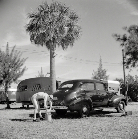 Photo showing: Pale Driver -- January 1941. Guest at Sarasota, Florida, trailer park washing his car.
