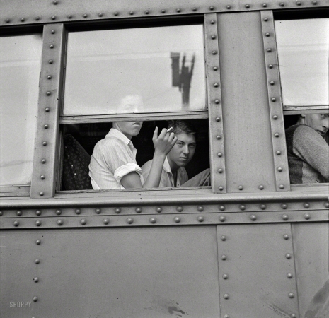 Photo showing: Our Excellent Adventure -- September 1942. Richwood, West Virginia. Young men on train leaving for
New York state, where they will help in the harvest of tomatoes, apples and other crops. 