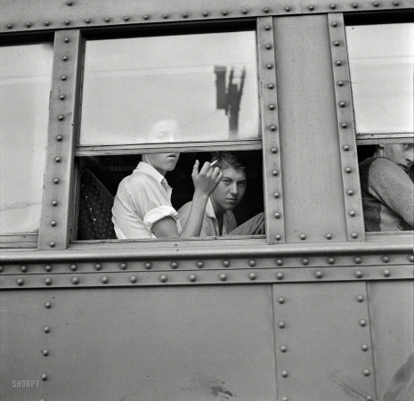 Photo showing: Our Excellent Adventure -- September 1942. Richwood, West Virginia. Young men on train leaving for
New York state, where they will help in the harvest of tomatoes, apples and other crops. 