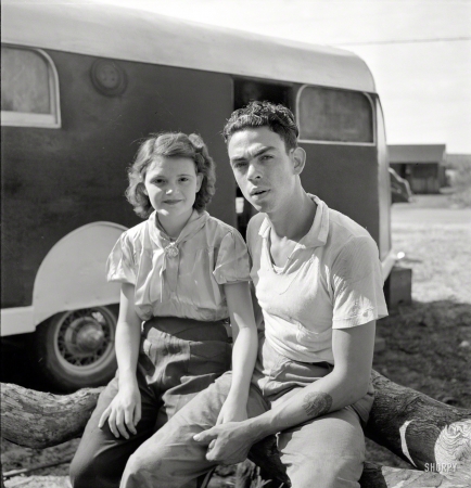 Photo showing: Fresh Picked -- February 1939. Young couple, migrant laborers, who work in packinghouse at Canal Point, Florida.