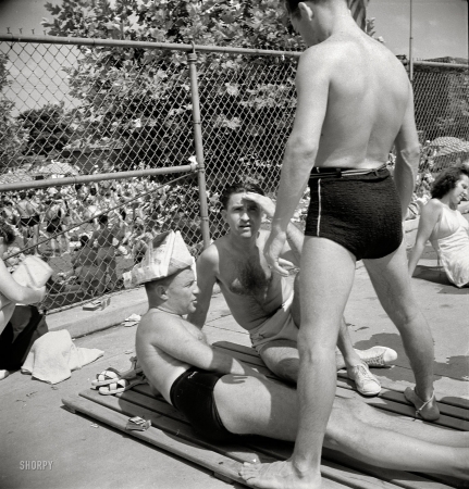 Photo showing: Newspaper Hat -- July 1942. Washington, D.C. Sunday at the edge of the municipal swimming pool.
