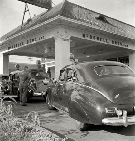 Photo showing: Gas Rationing -- Washington, D.C. At 7 a.m. on June 21, 1942, the day before stricter gas rationing was
enforced, cars were pouring into this gas station on upper Wisconsin Avenue.