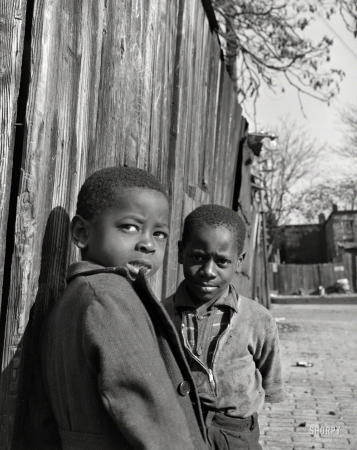 Photo showing: Life in Wartime -- November 1942. Washington, D.C. Southwest section. Two Negro boys.