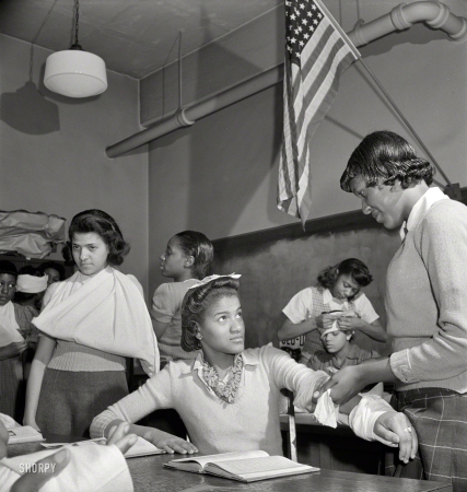 Photo showing: First Aid Class -- March 1942. Washington, D.C. First aid class at the Banneker Junior High School.