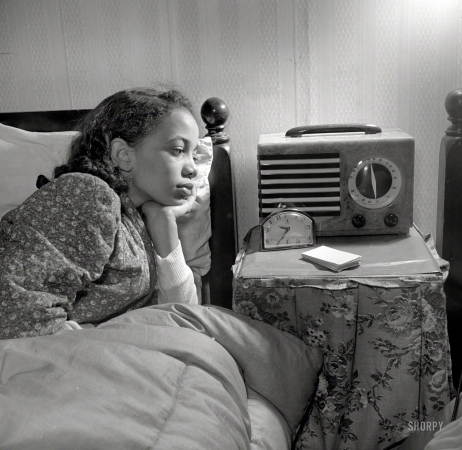 Photo showing: A Girl Can Dream -- Winter 1942. Washington, D.C. Young niece of Jewel Mazique, worker at the Library of Congress, who lives with her aunt.